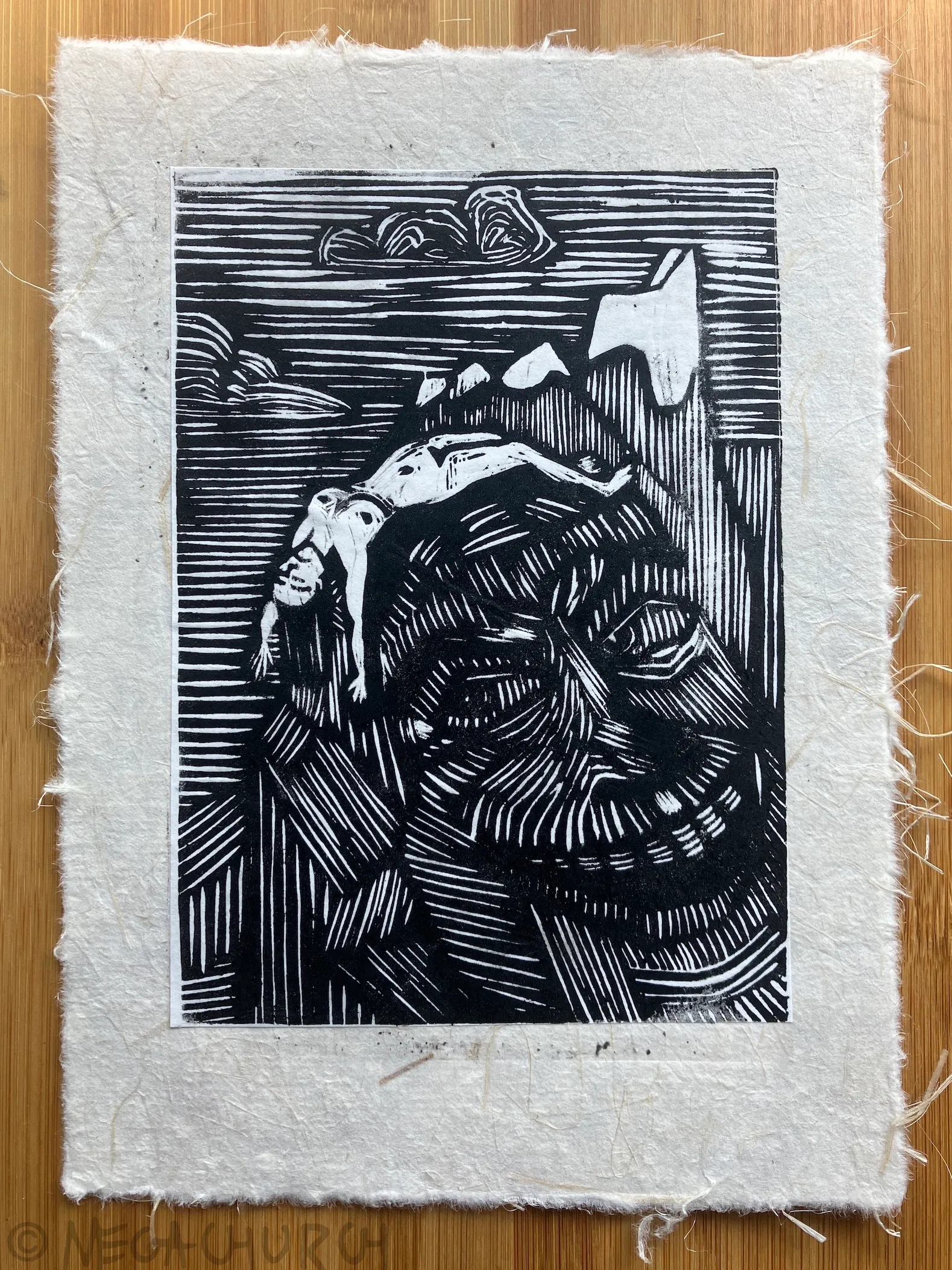 A relief print of various mountain peaks, on the nearest of which a woman's naked body is stretched out across it. The mountain's features have the appearance of a meanacing, grinning face, eyes looking towards the lifeless body.