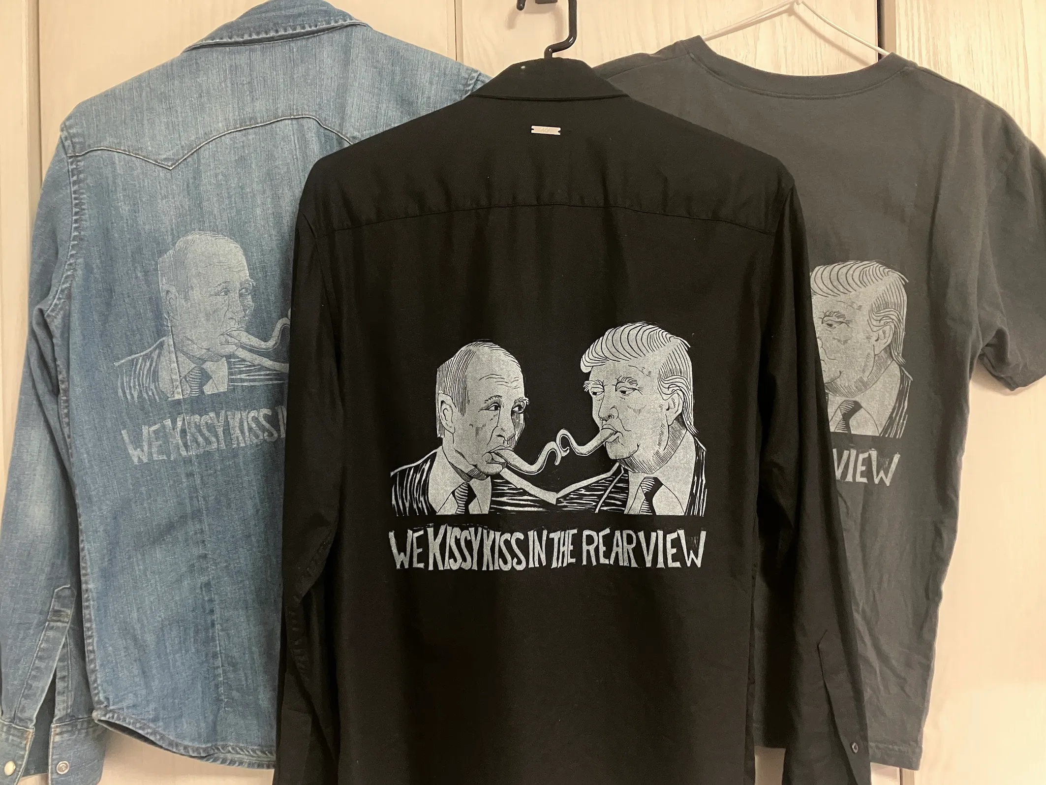 Three different styles of shirt with the Kissy Kiss image printed on each.