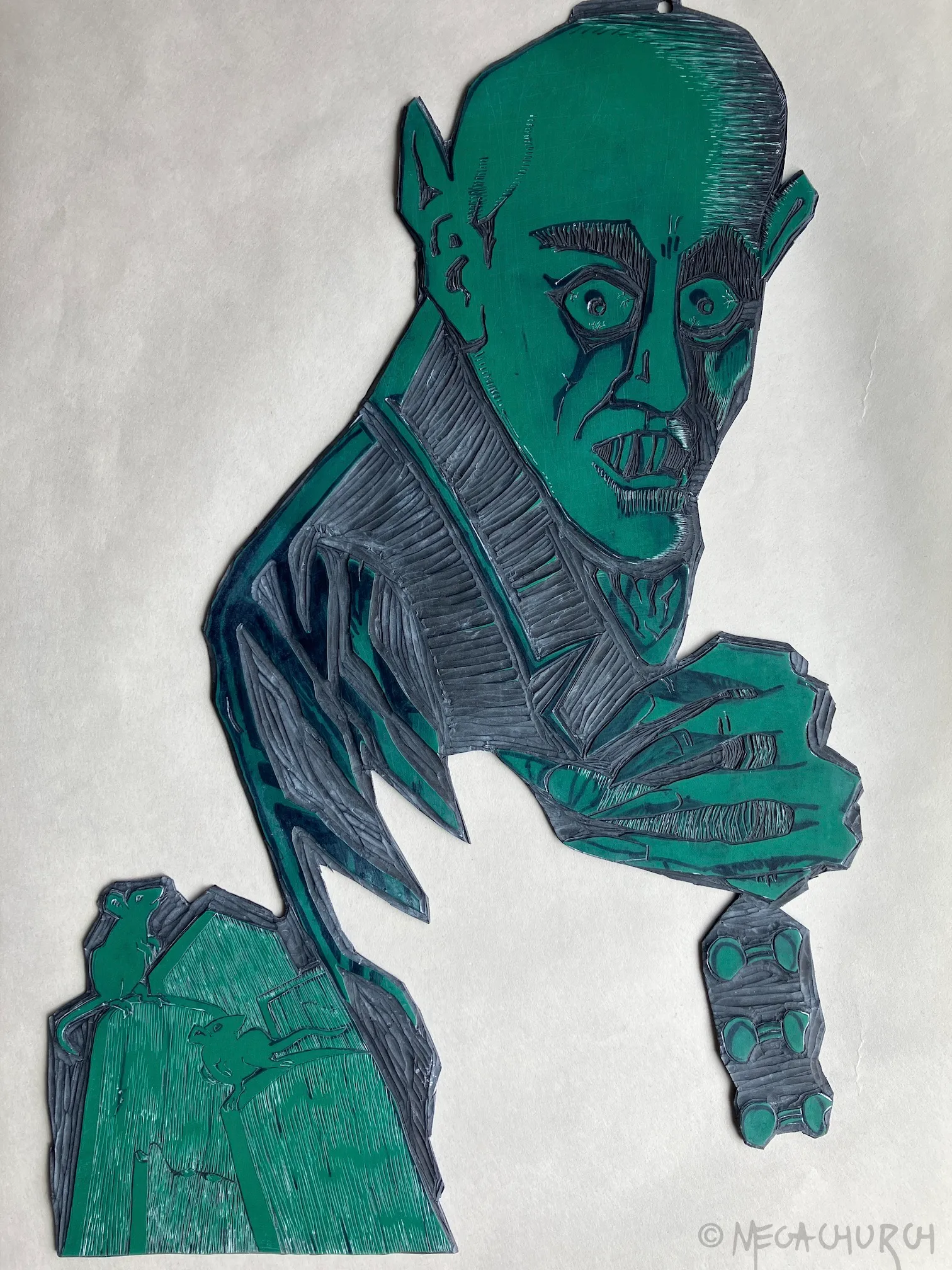 A vinyl plate into which the Vampyre image has been carved out.