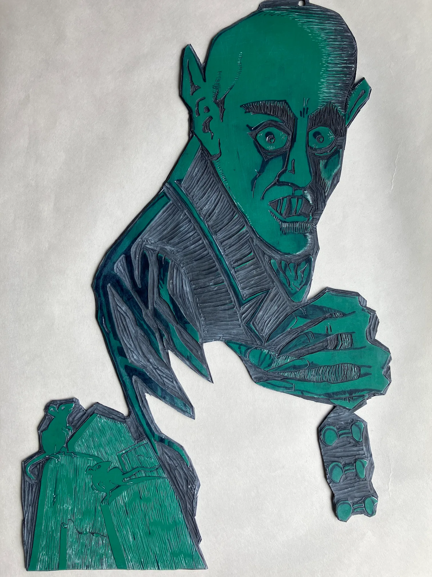 A vinyl plate into which the Vampyre image has been carved out.
