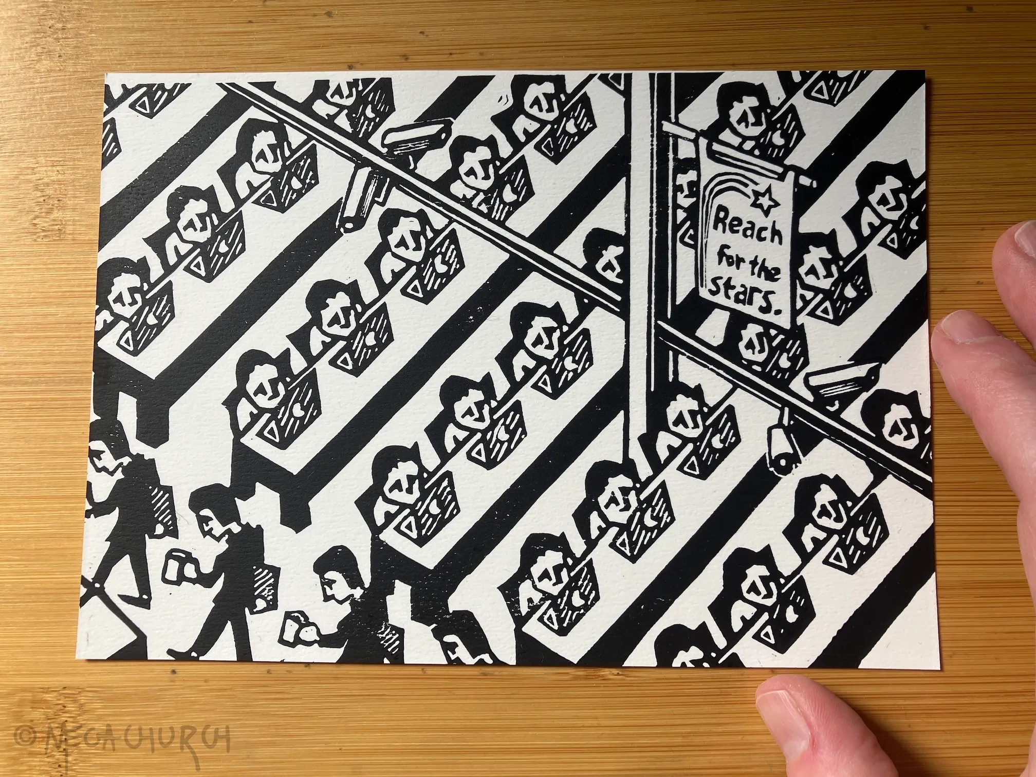 A relief print of rows of identical, sad-looking workers sitting in front of computers. There are surveillance cameras in the rafters and a banner that reads "Reach for the Stars".