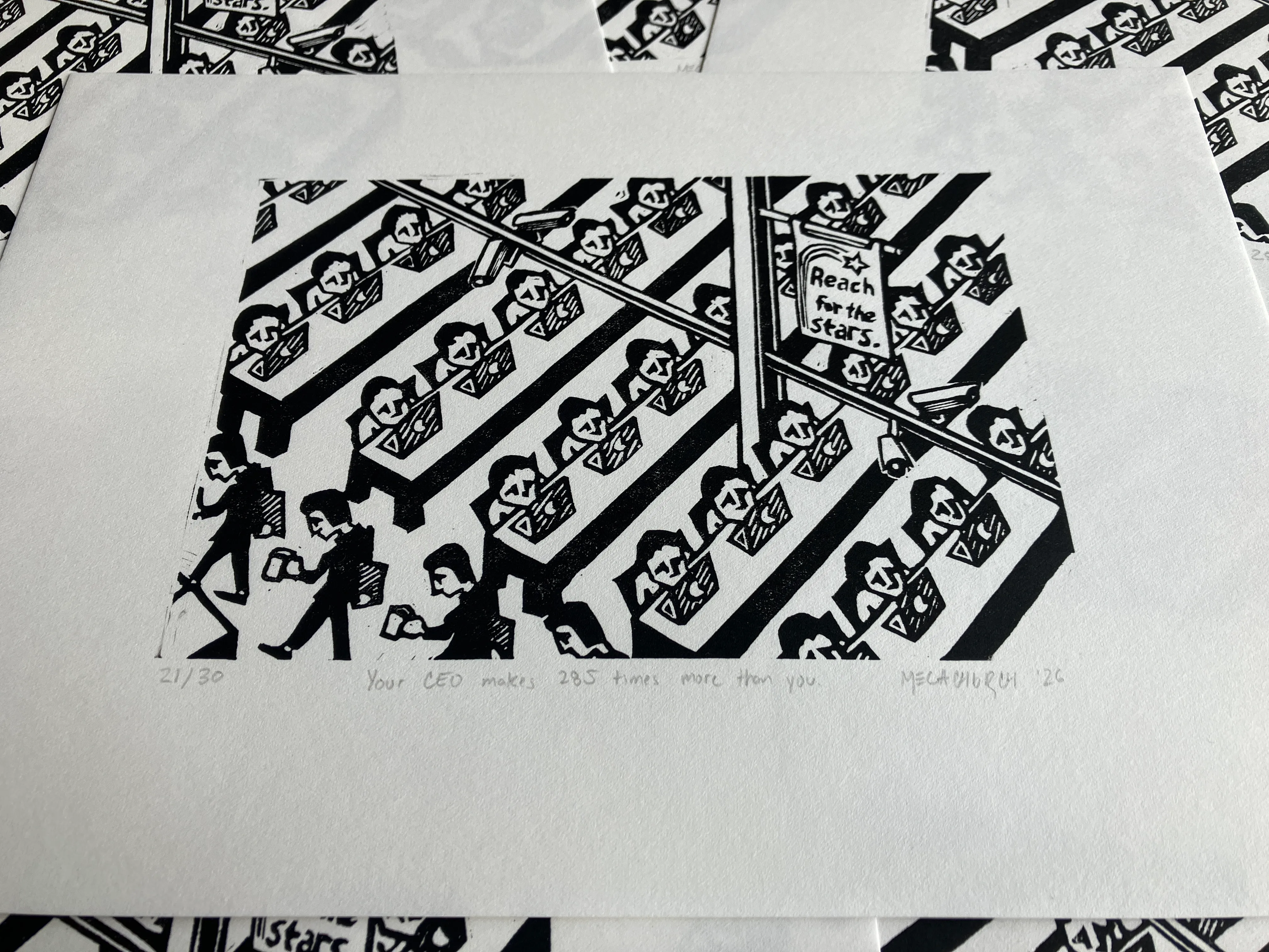 Several copies of the "Your CEO makes 285 times more than you" print arranged decoratively.