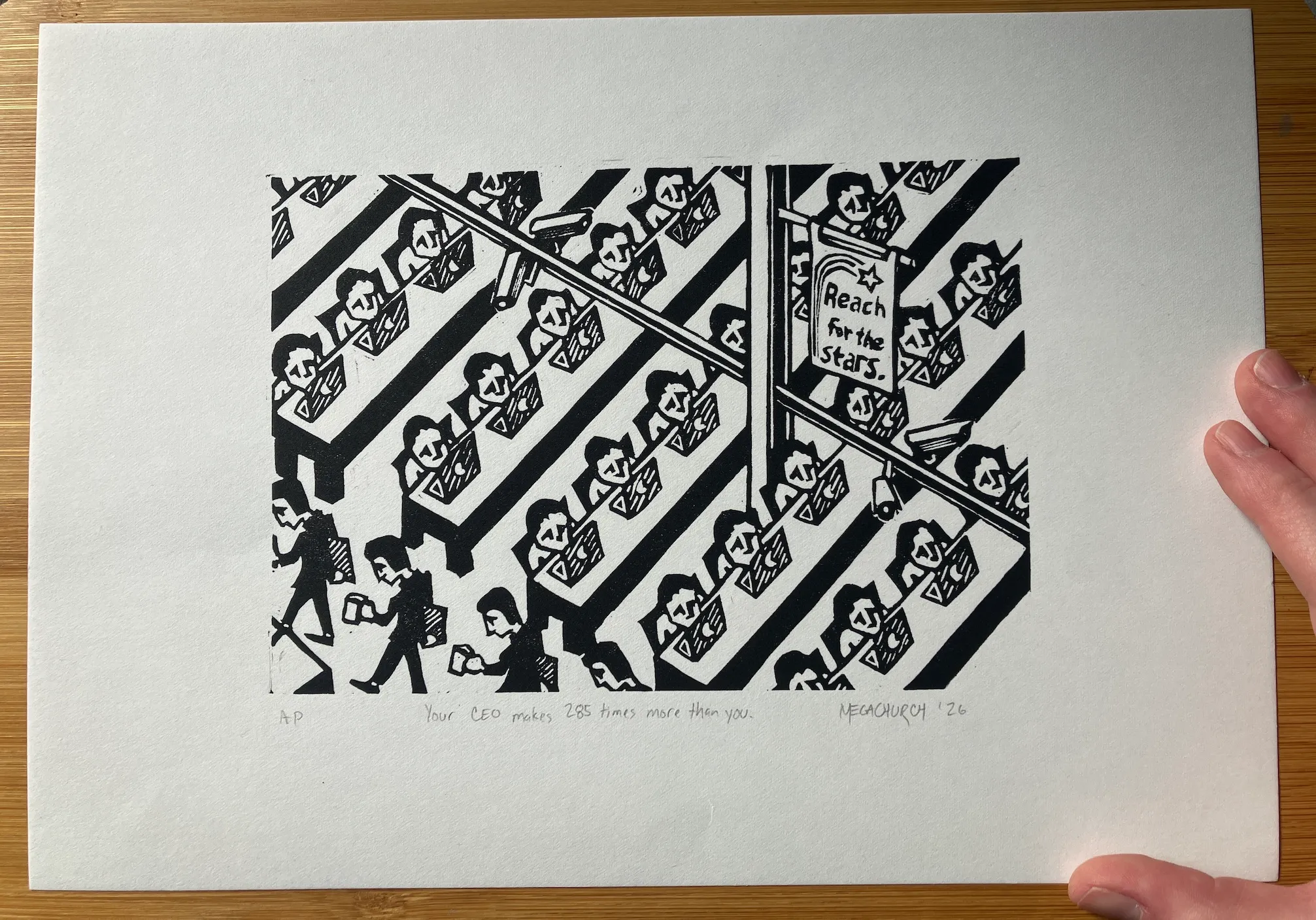 A relief print on large of identical, sad-looking workers sitting in front of computers. There are surveillance cameras in the rafters and a banner that reads "Reach for the Stars".